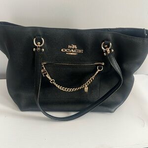 Coach black and gold medium size tote bag.